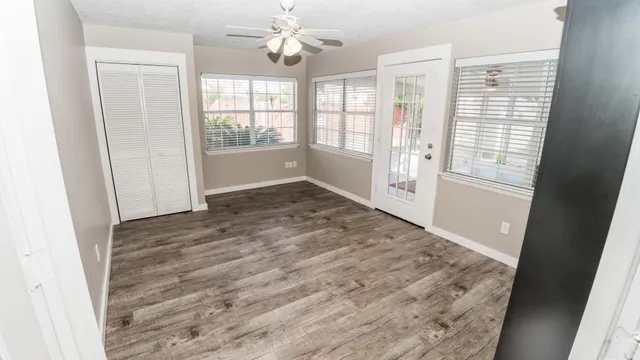 a view of an empty room with a window