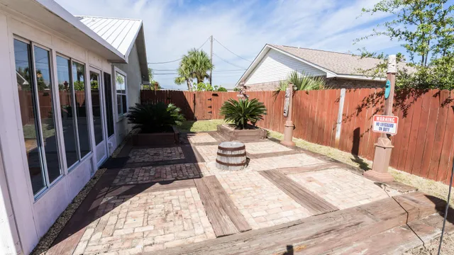 a view of a chairs and table in backyard