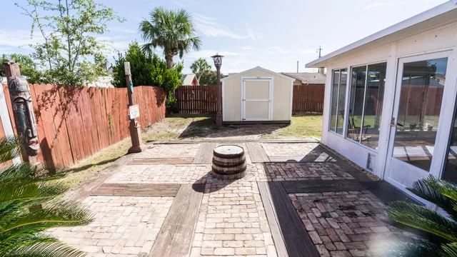 a view of a pathway with a backyard