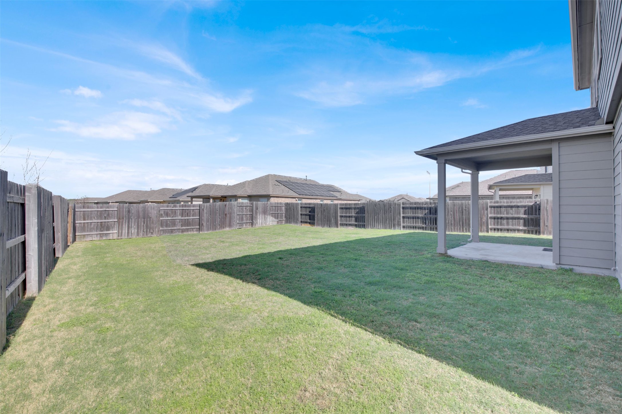 13716 Sugar Bush Path Manor, TX 78653 - Photo 9 of 37 Fenced backyard featuring a patio area