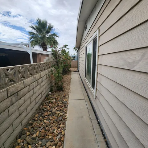 a view of a pathway of a house with wooden floor