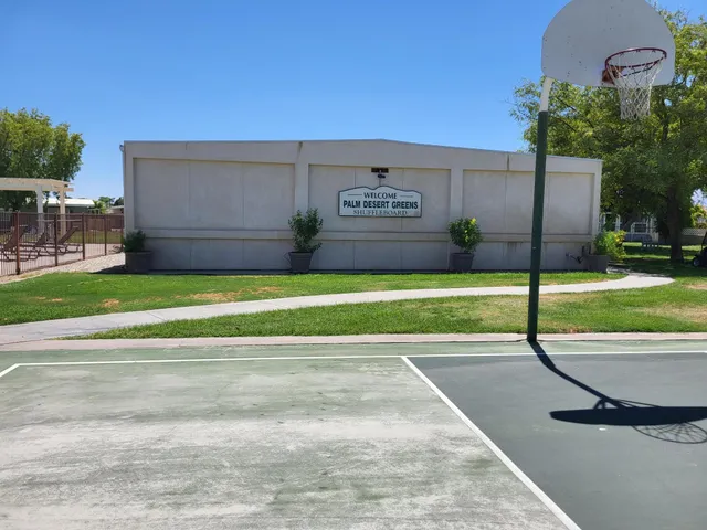 a view of a swimming pool with a yard