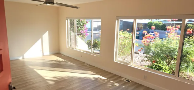 a view of a room with windows and entryway