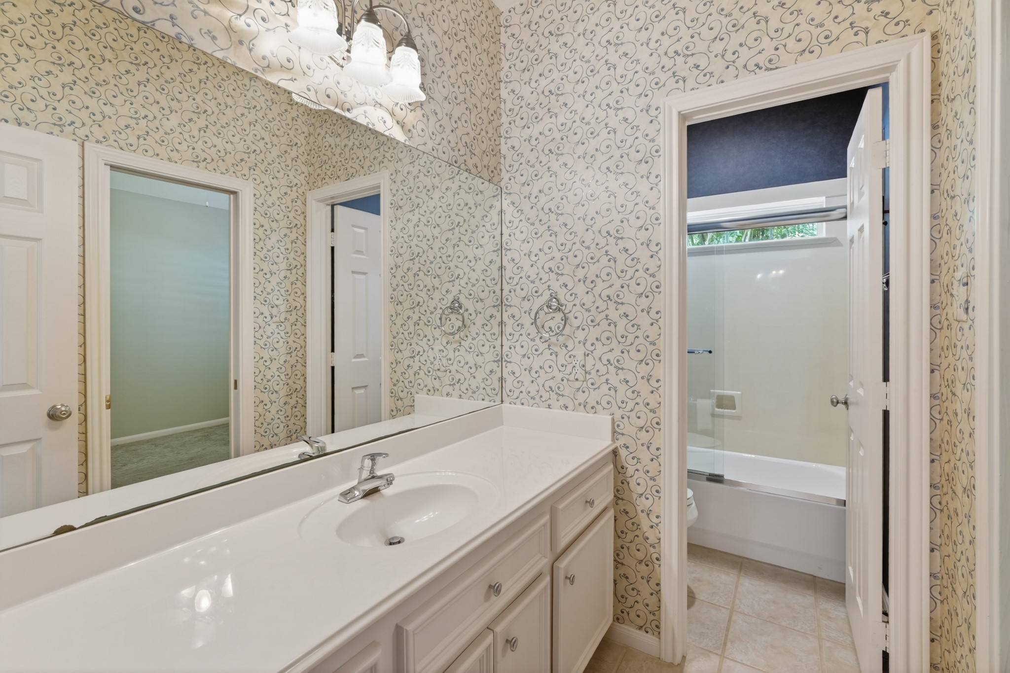20714 Flora View Court Spring, TX 77379 - Photo 32 of 40 a bathroom with a tub sink and mirror