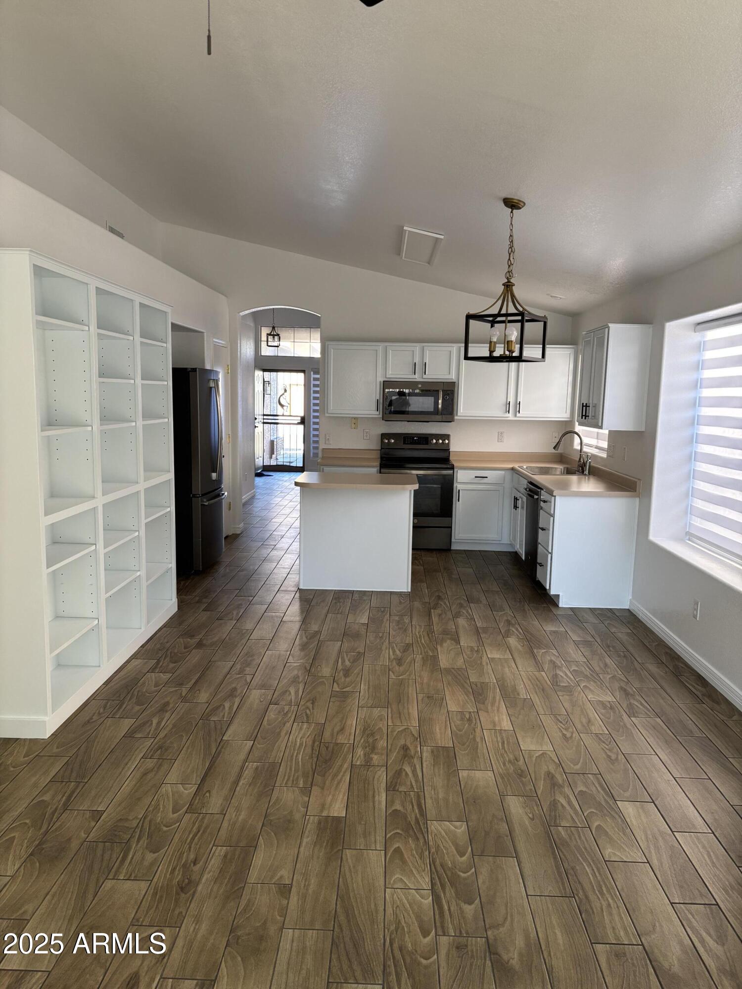 249 West Grovers Avenue Phoenix, AZ 85023 - Photo 3 of 6 a kitchen with a sink and wooden floor