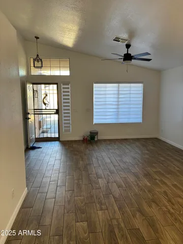 a view of an empty room with a window