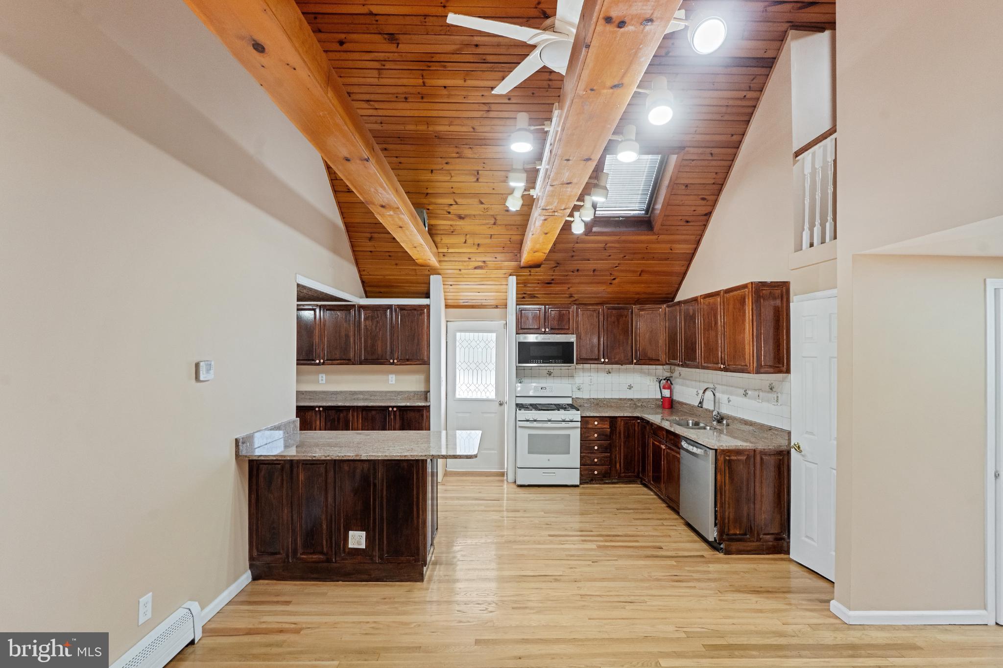 3850 Highway 27 Princeton, NJ 08540 - Photo 11 of 35 a kitchen with stainless steel appliances granite countertop a stove and a sink