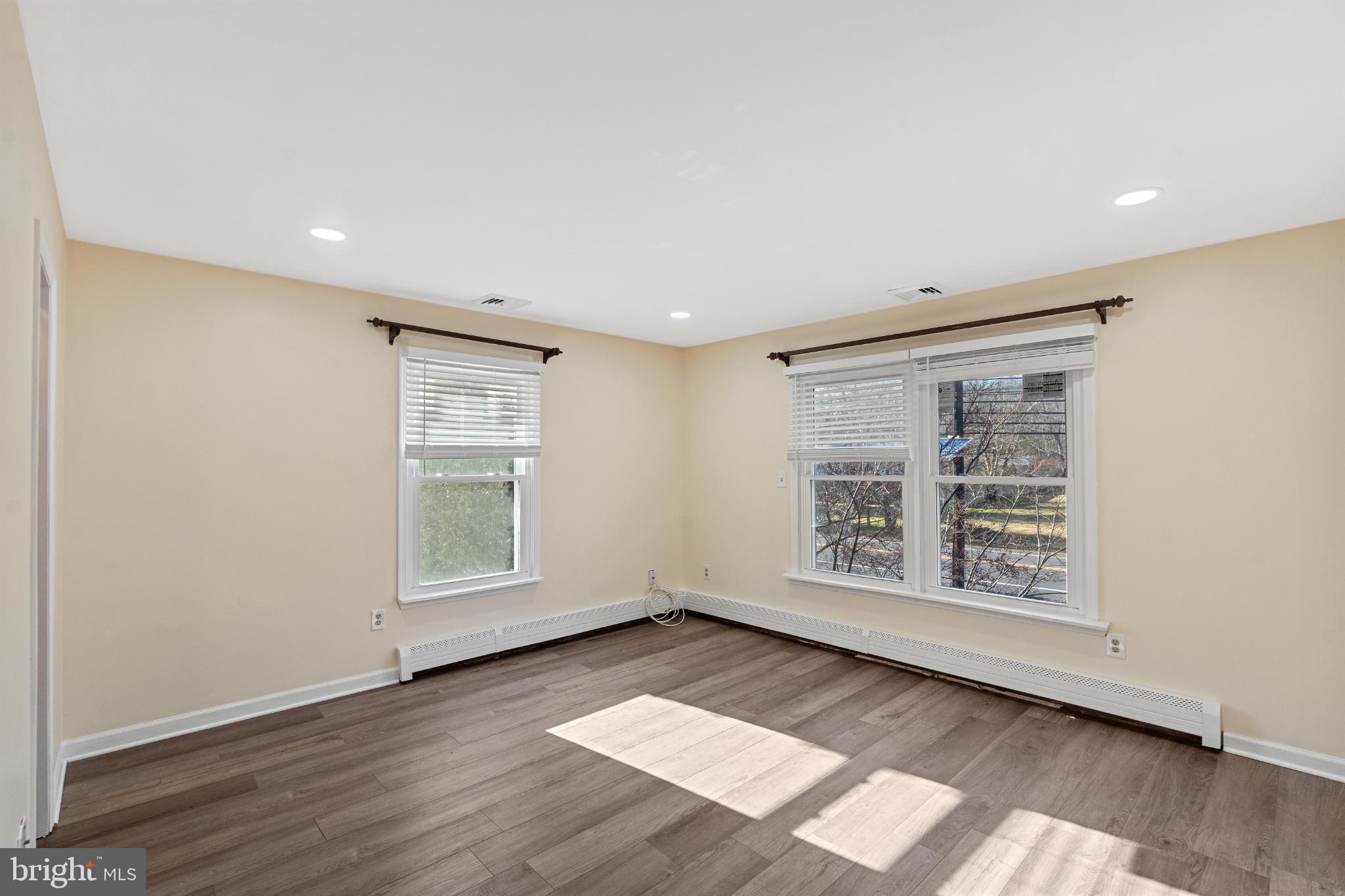 3850 Highway 27 Princeton, NJ 08540 - Photo 17 of 35 an empty room with wooden floor and windows