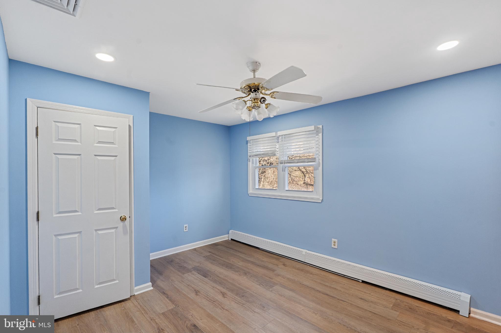 3850 Highway 27 Princeton, NJ 08540 - Photo 19 of 35 an empty room with a window and a ceiling fan