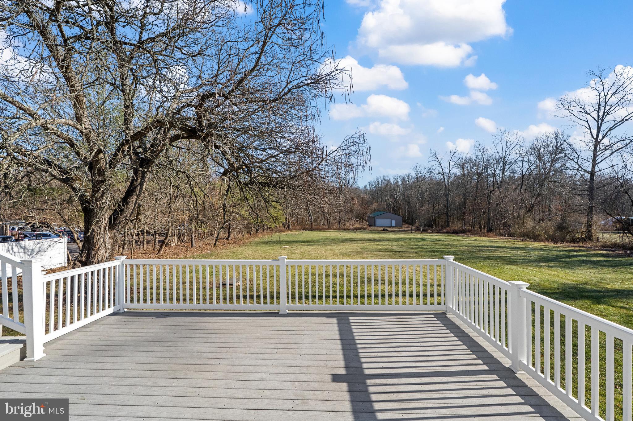 3850 Highway 27 Princeton, NJ 08540 - Photo 29 of 35 a view of a deck and trees with wooden fence