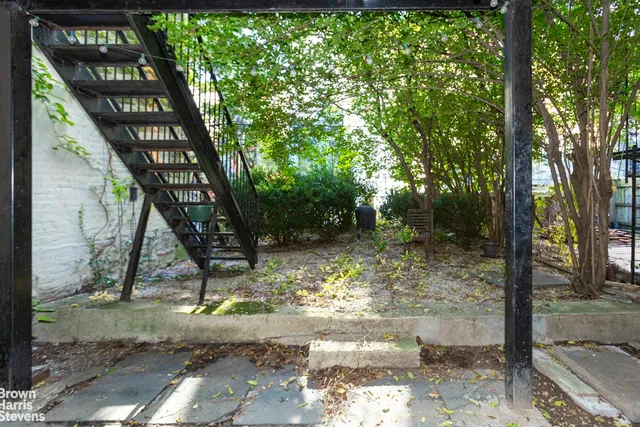 a kitchen with stainless steel appliances granite countertop a sink and a refrigerator