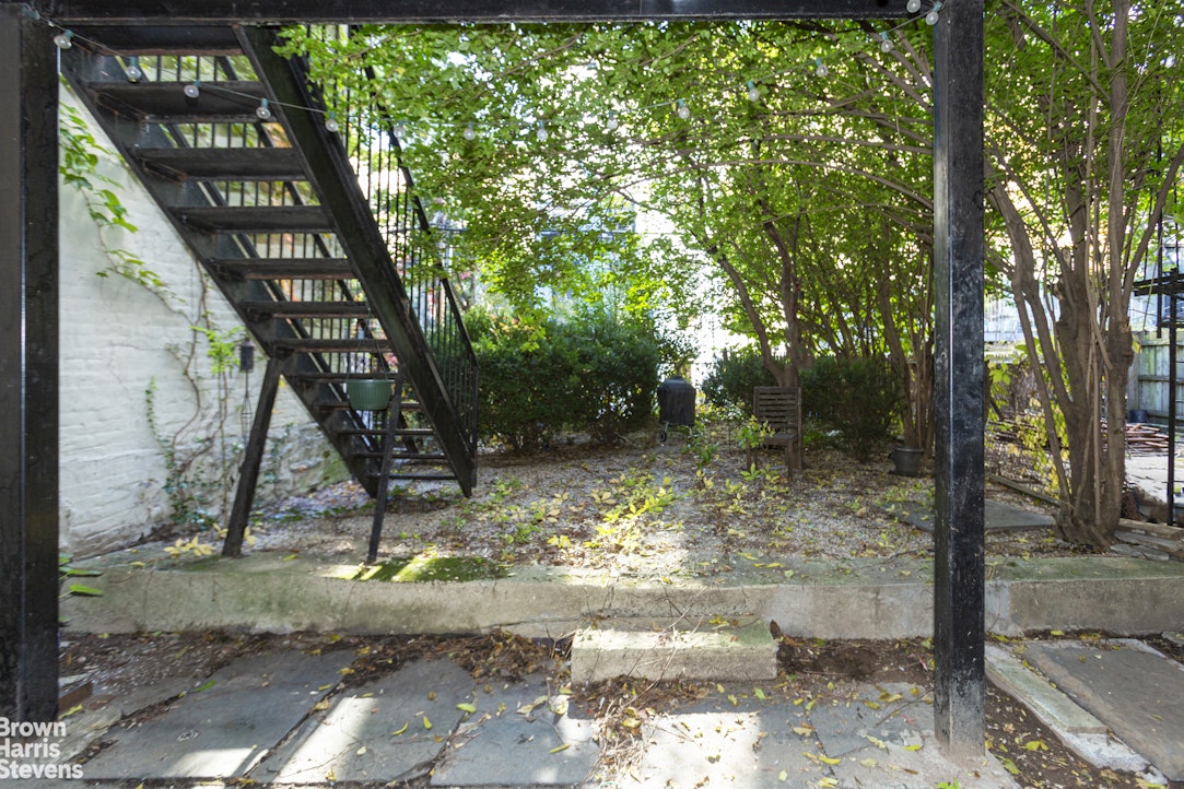 823 Union Street Brooklyn, NY 11215 - Photo 16 of 17 a view of a tree in front of a house