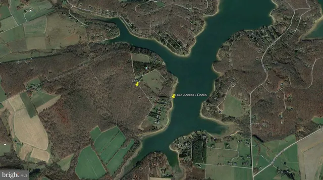 a view of a dry yard with mountains in the background