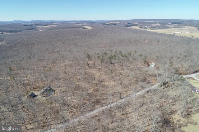 an aerial view of mountain with outdoor space