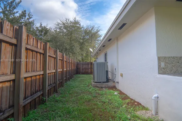 a view of a house with yard and a garden