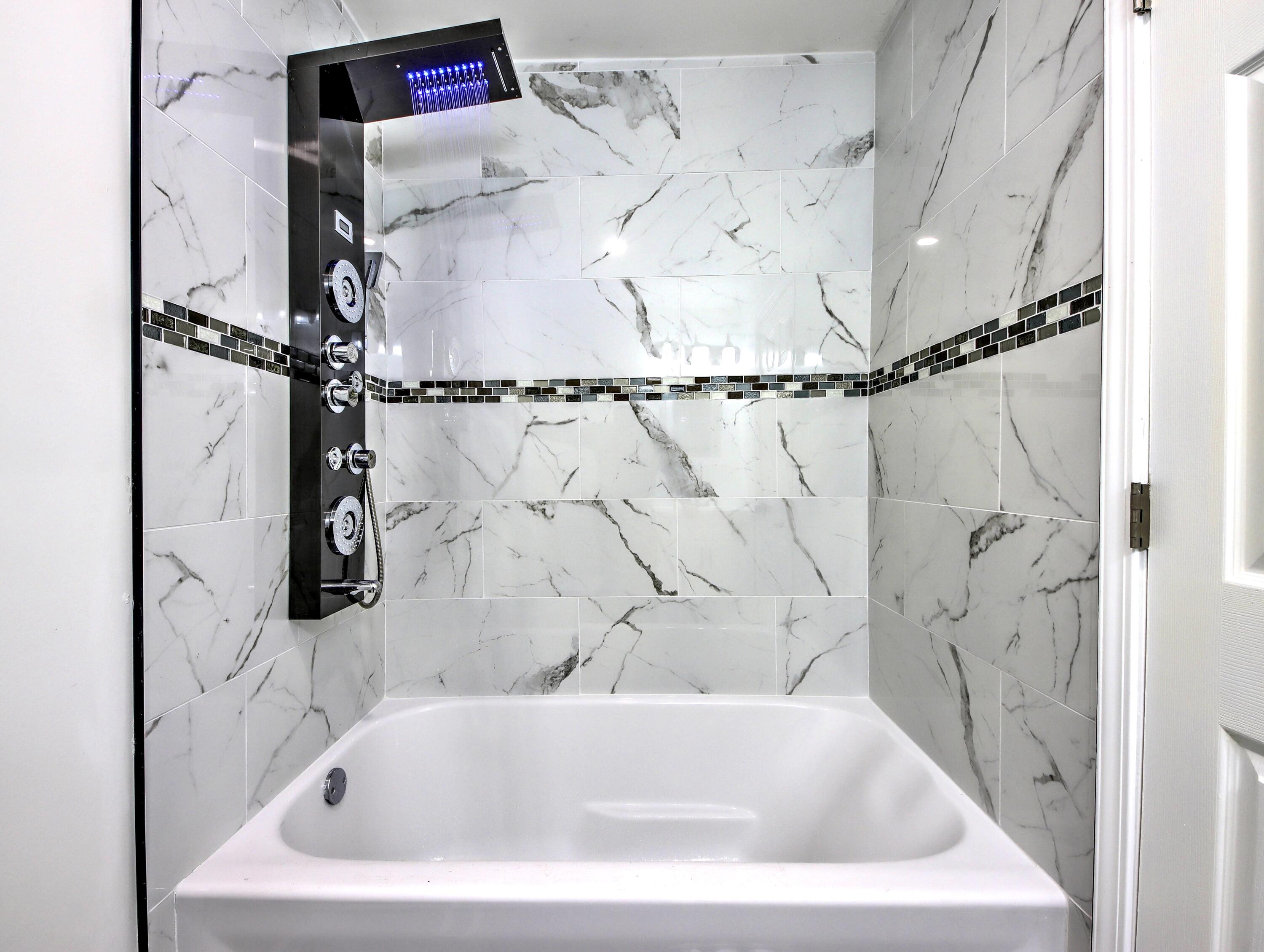 315 Holly Drive Walkerton, IN 46574 - Photo 15 of 33 a white bath tub sitting in a bathroom