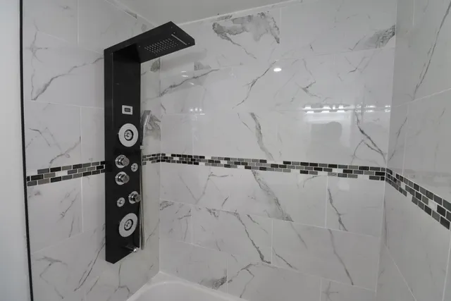 a bathroom with a shower and a shower