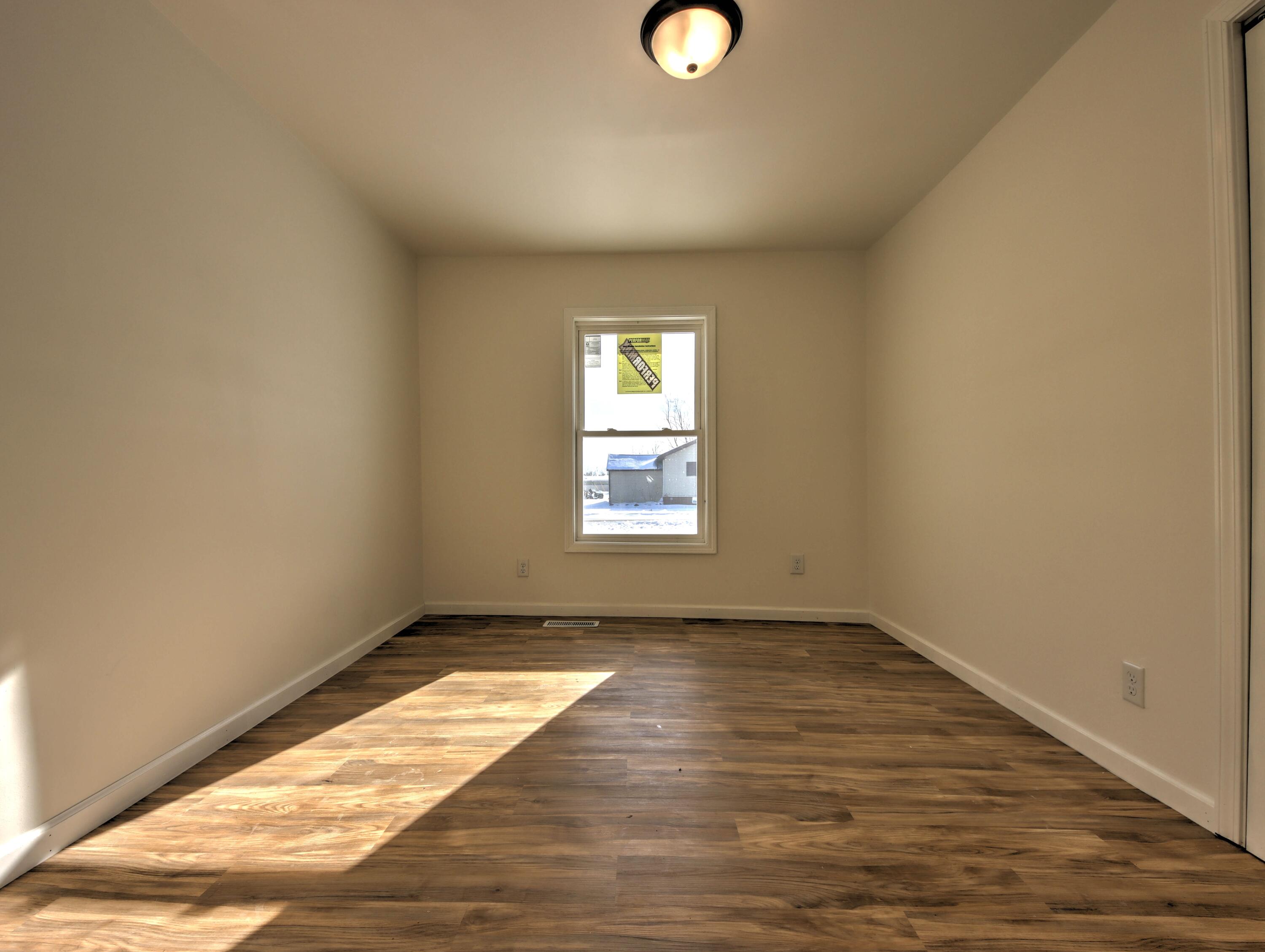 315 Holly Drive Walkerton, IN 46574 - Photo 16 of 33 a view of empty room with wooden floor