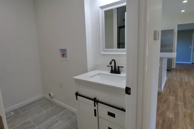 a bathroom with a sink and a mirror