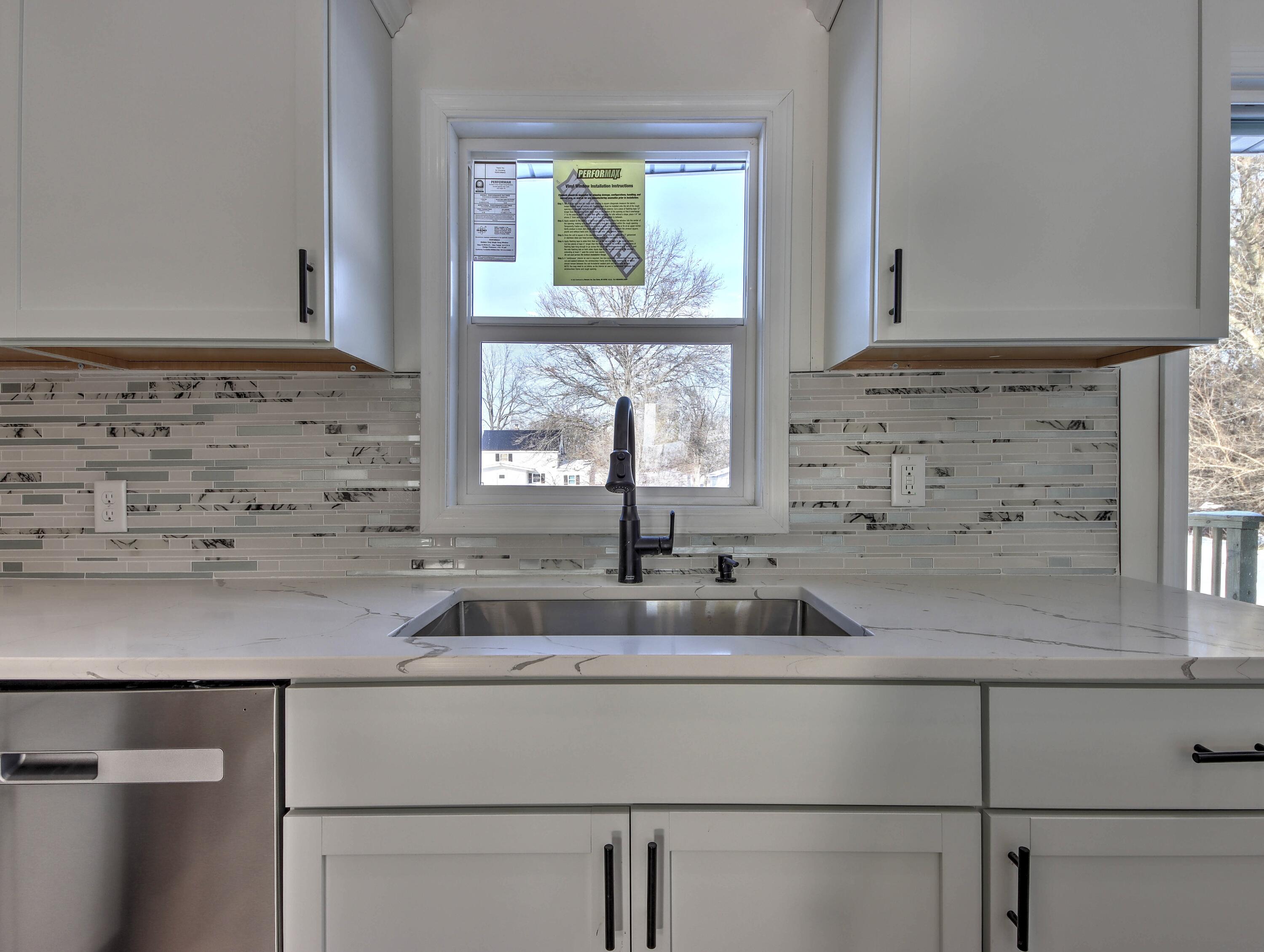 315 Holly Drive Walkerton, IN 46574 - Photo 10 of 33 a kitchen with a sink and cabinets