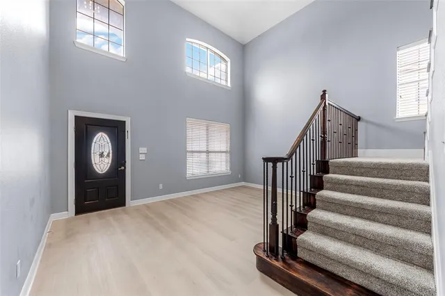 a view of an entryway with wooden floor