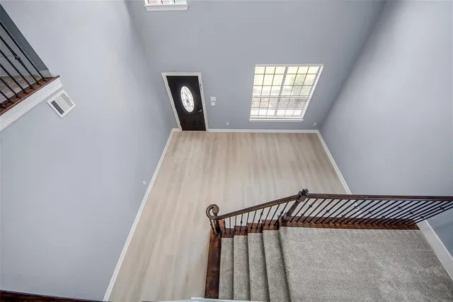 a view of a livingroom with a chandelier fan
