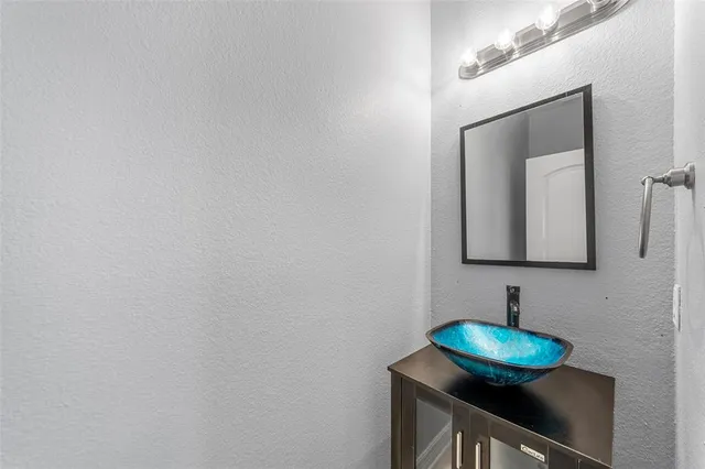 a kitchen with a stove a sink and a refrigerator