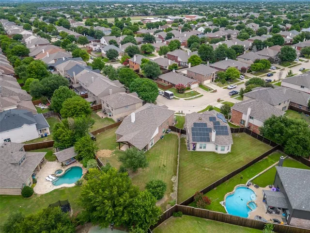 an aerial view of a house with a garden