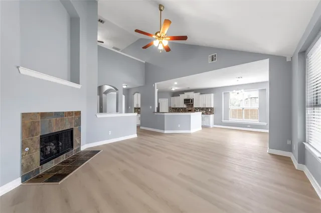 a view of a kitchen with a stove cabinets and a fireplace
