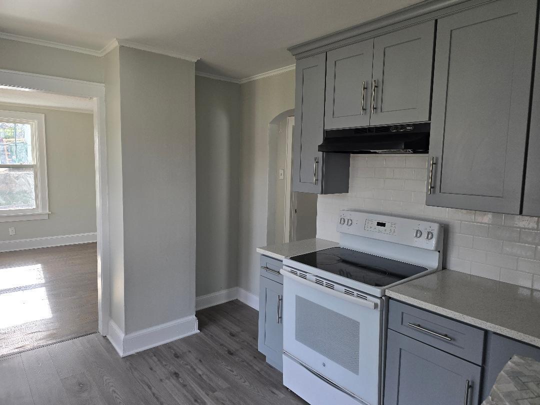 22 Holly Street Waterbury, CT 06706 - Photo 2 of 5 a kitchen with cabinets and steel appliances
