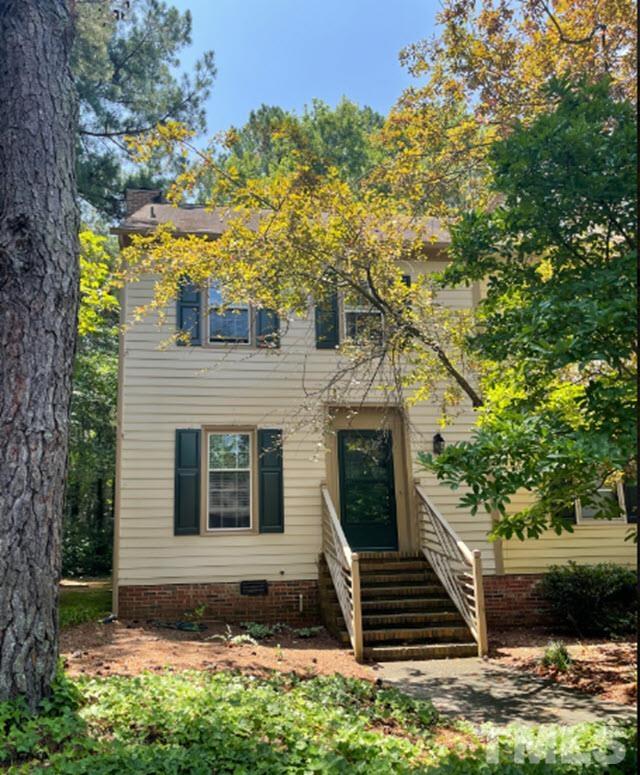 3229 Coachman's Way Durham, NC 27705 - Photo 2 of 10 a view of a yard in front of a house with large trees