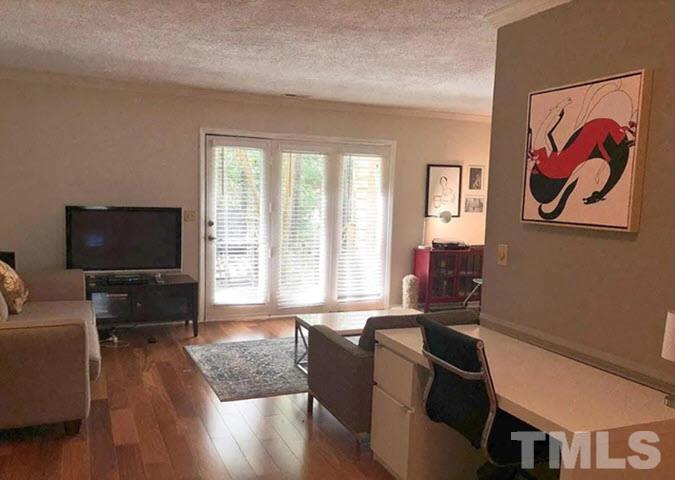 3229 Coachman's Way Durham, NC 27705 - Photo 7 of 10 a living room with furniture and a flat screen tv