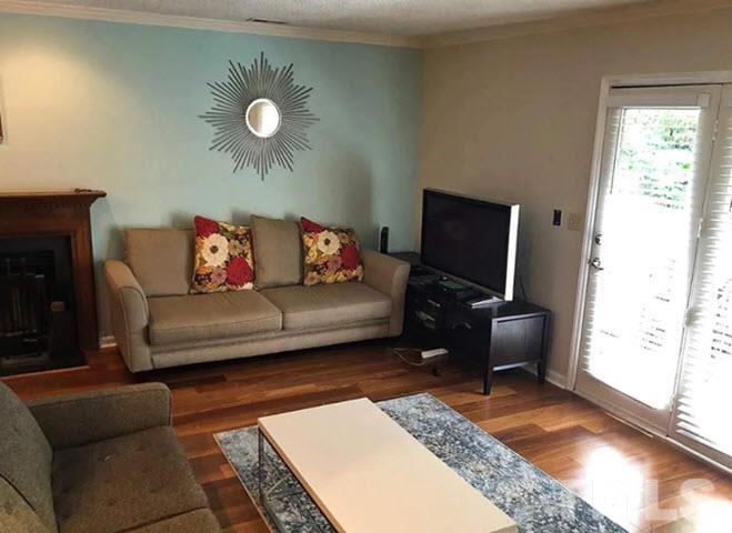 3229 Coachman's Way Durham, NC 27705 - Photo 10 of 10 a living room with furniture and a flat screen tv