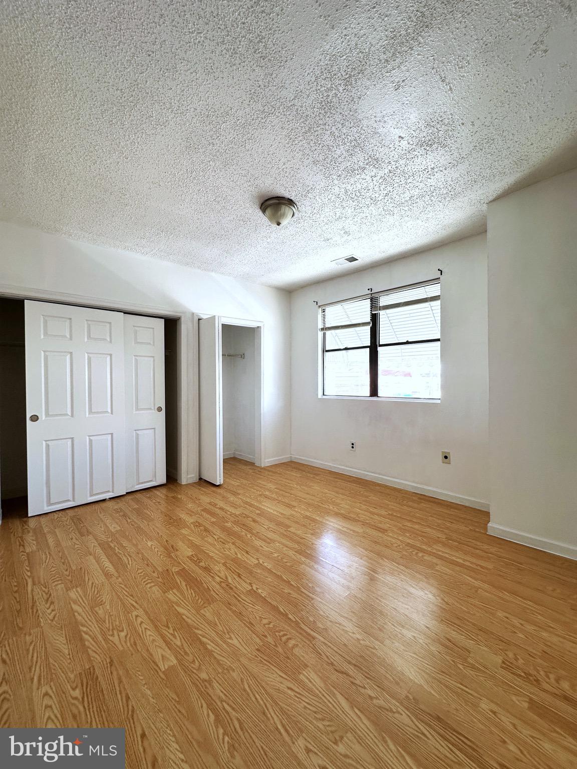 2600 South Mildred Street Philadelphia, PA 19148 - Photo 3 of 6 a view of empty room with wooden floor and fan
