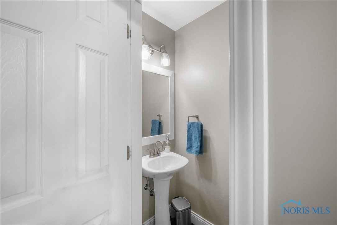 7456 Club Road Sylvania, OH 43560 - Photo 36 of 44 First floor powder room off the hallway between the front foyer and the kitchen