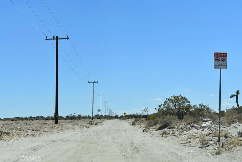 14500 Ave R Littlerock Ca Littlerock, CA 93543 - Photo 7 of 8 a view of a dirt road with a building in the background