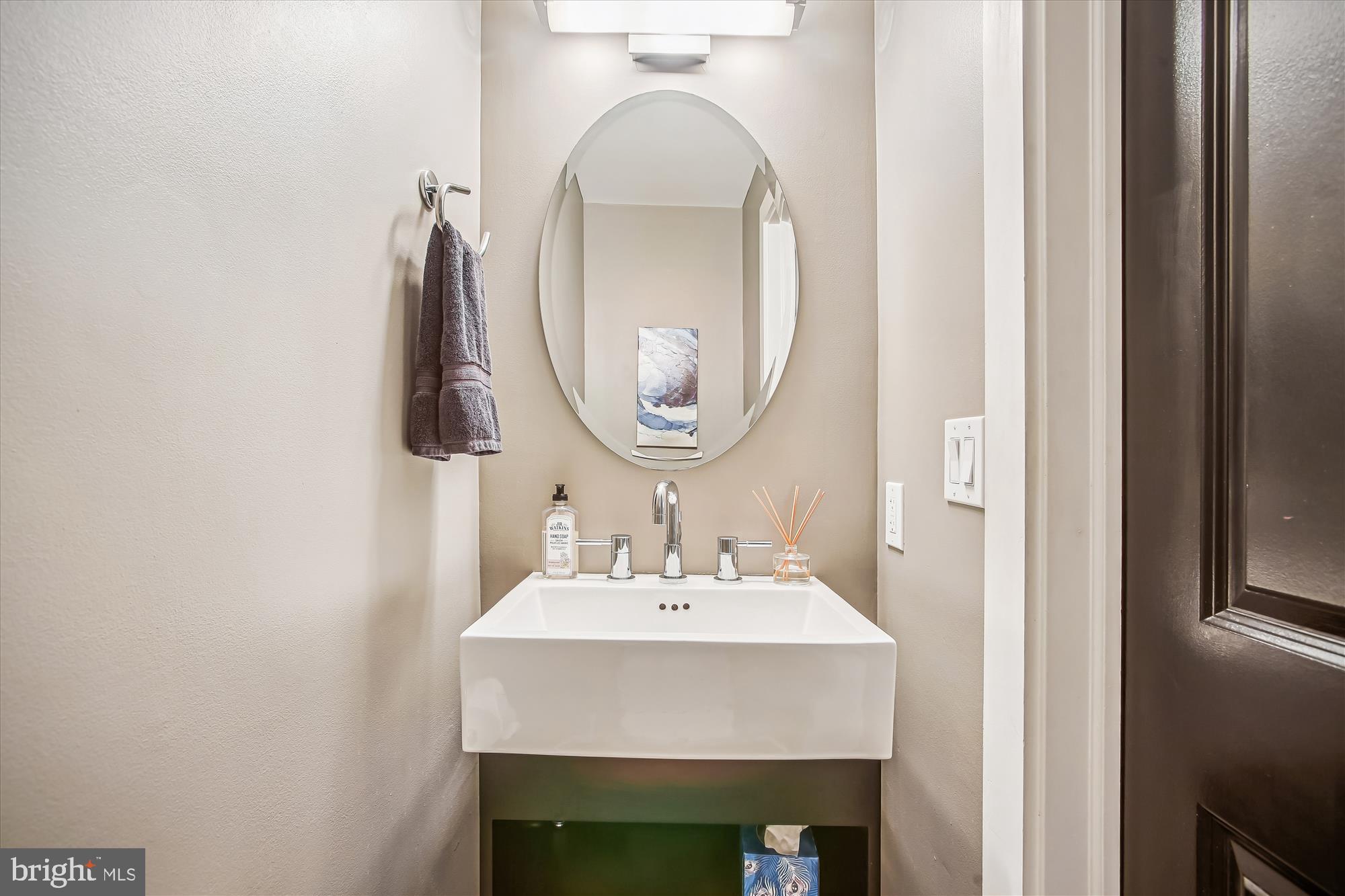 1521 9th Street Northwest Washington, DC 20001 - Photo 13 of 35 a bathroom with a sink and a mirror