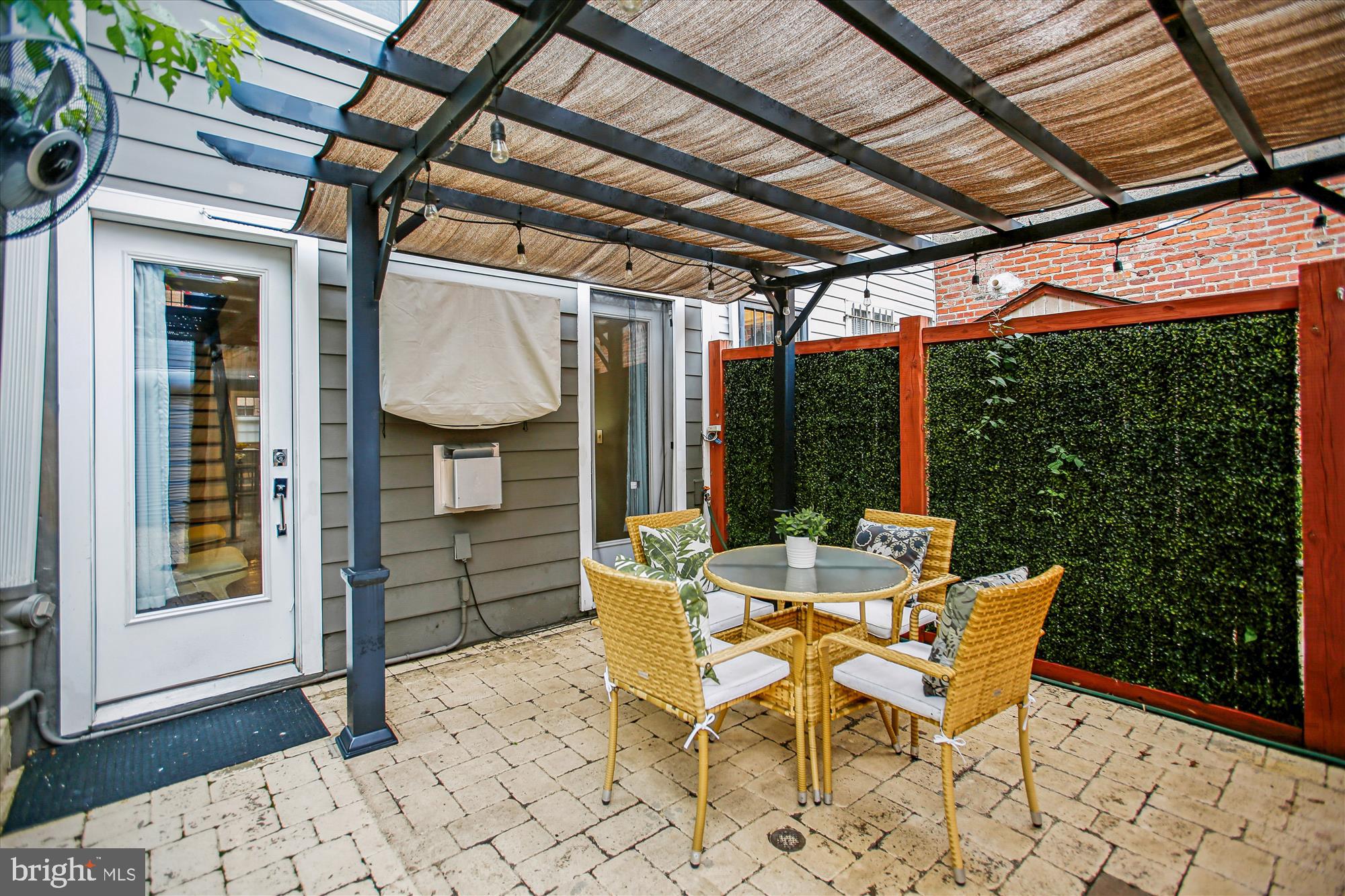 1521 9th Street Northwest Washington, DC 20001 - Photo 16 of 35 a patio with table and chairs and potted plants