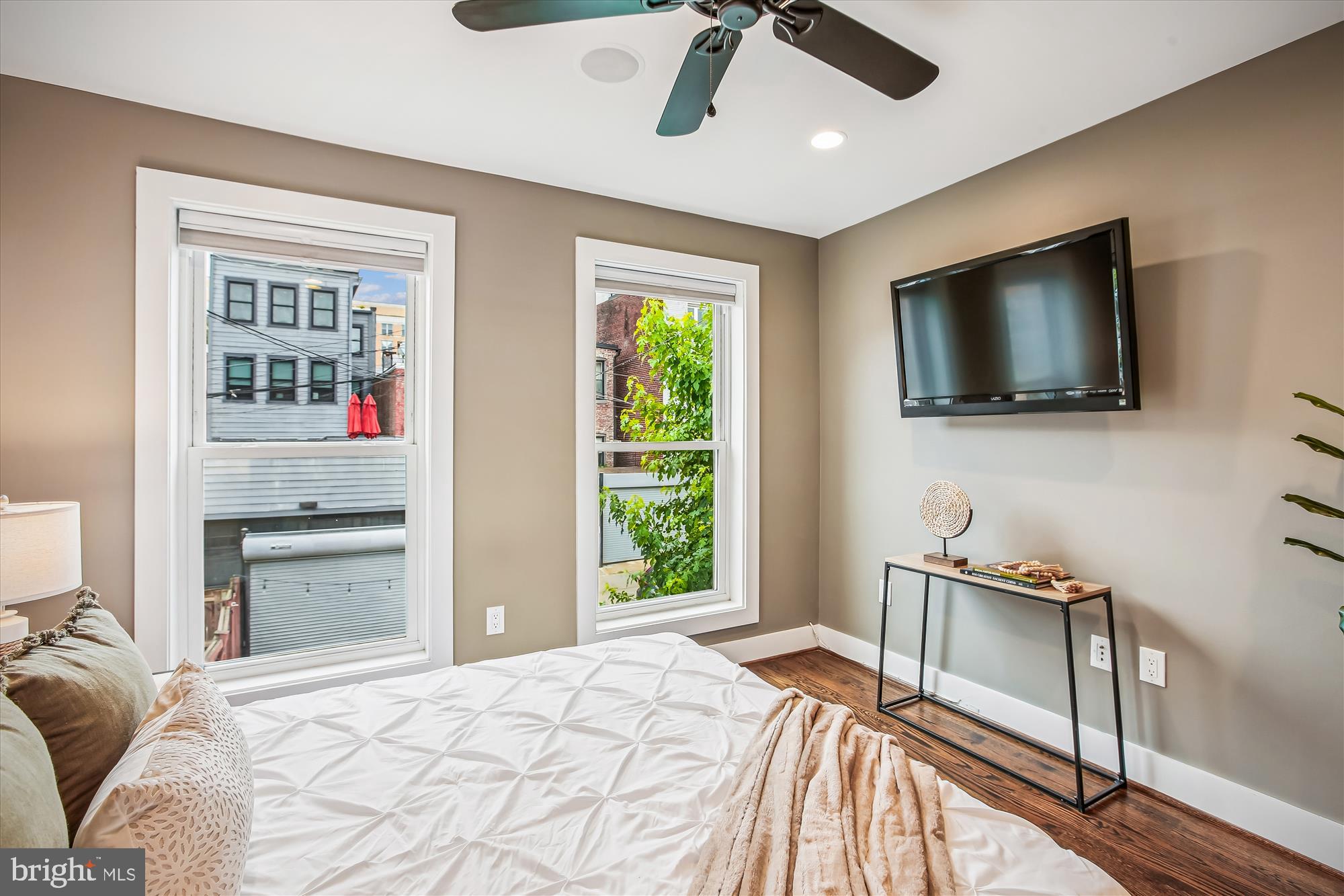 1521 9th Street Northwest Washington, DC 20001 - Photo 20 of 35 a bedroom with a bed and a flat screen tv