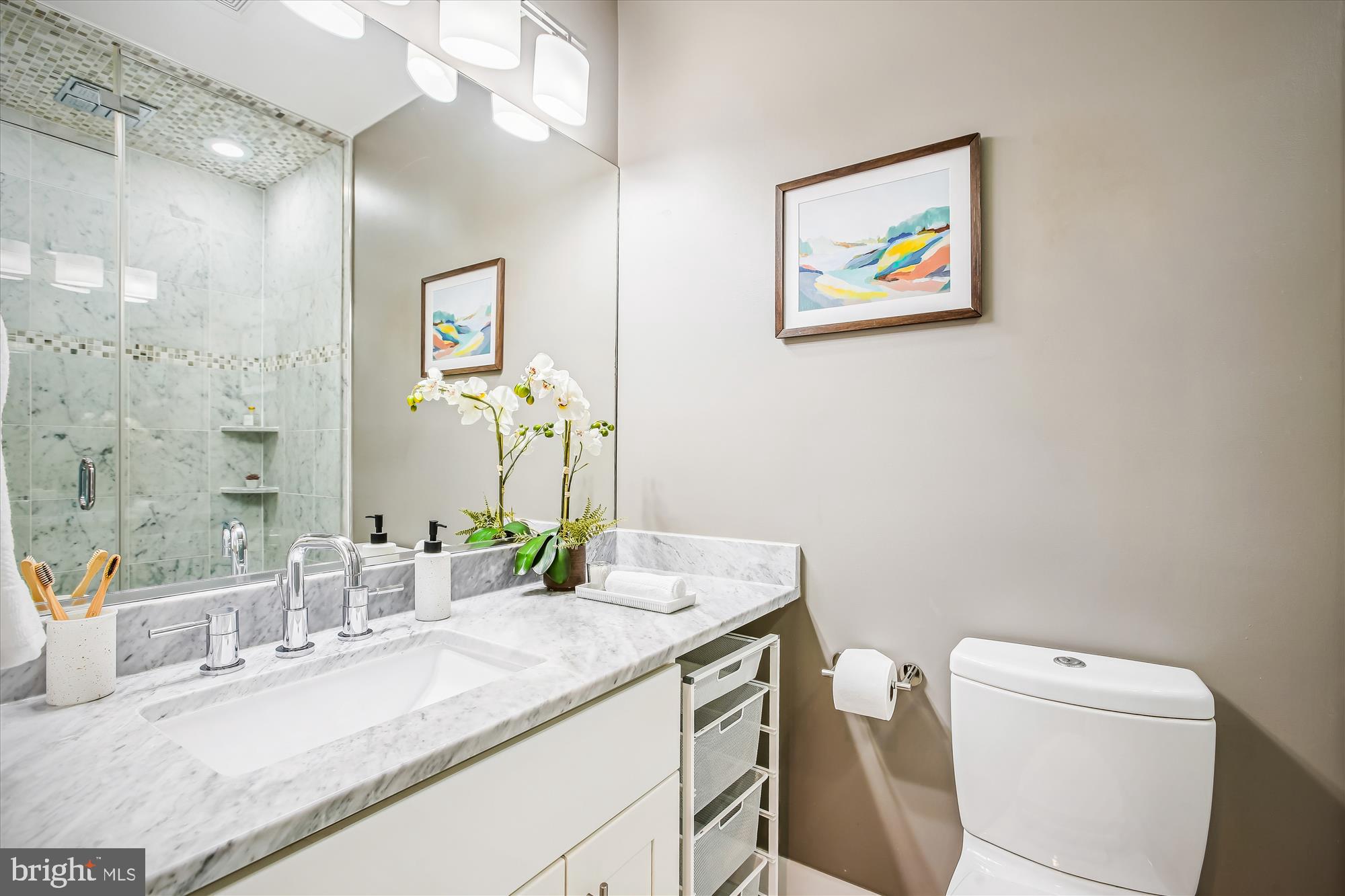 1521 9th Street Northwest Washington, DC 20001 - Photo 21 of 35 a bathroom with a granite countertop sink mirror vanity and toilet