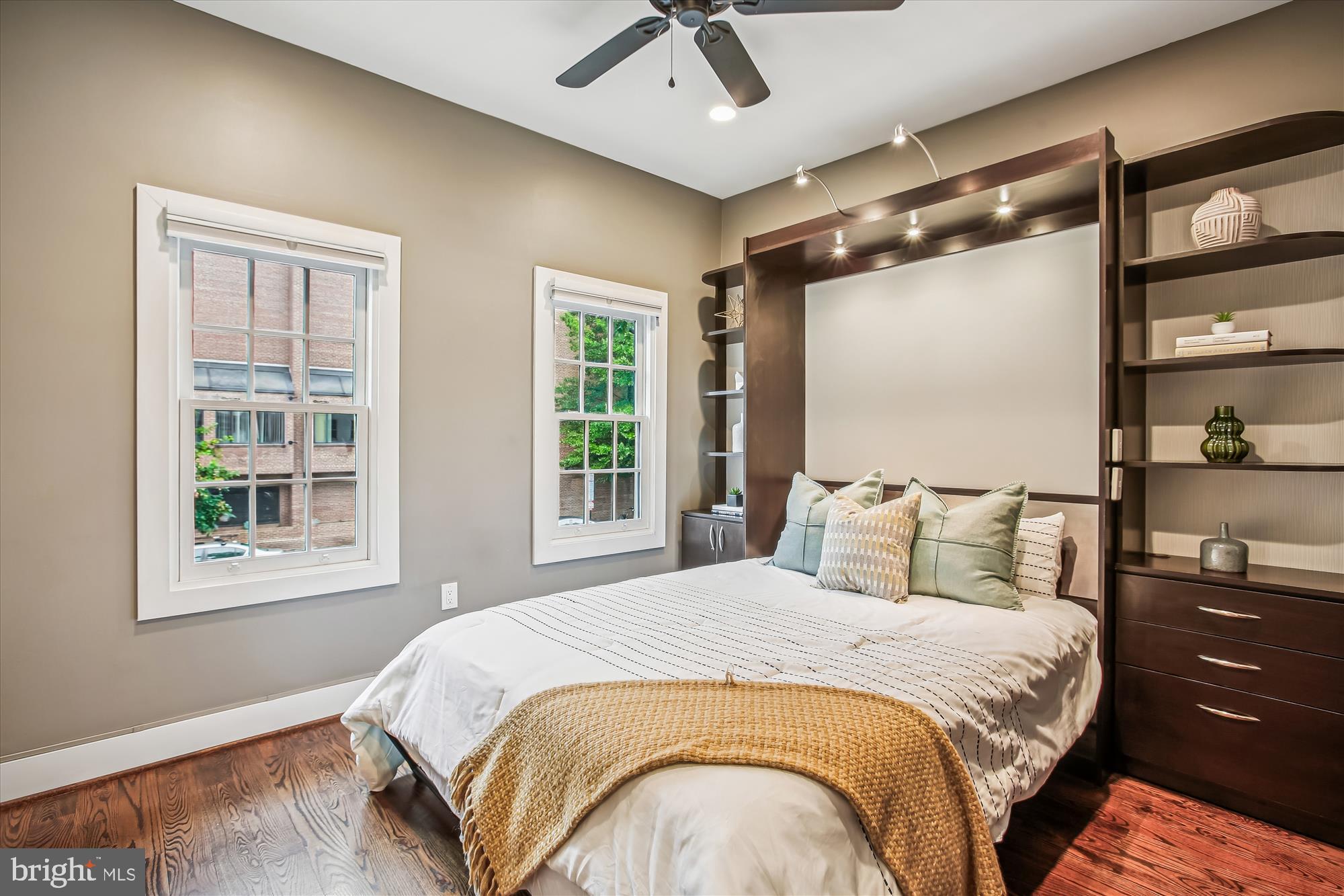 1521 9th Street Northwest Washington, DC 20001 - Photo 23 of 35 a bedroom with a bed mirror and window