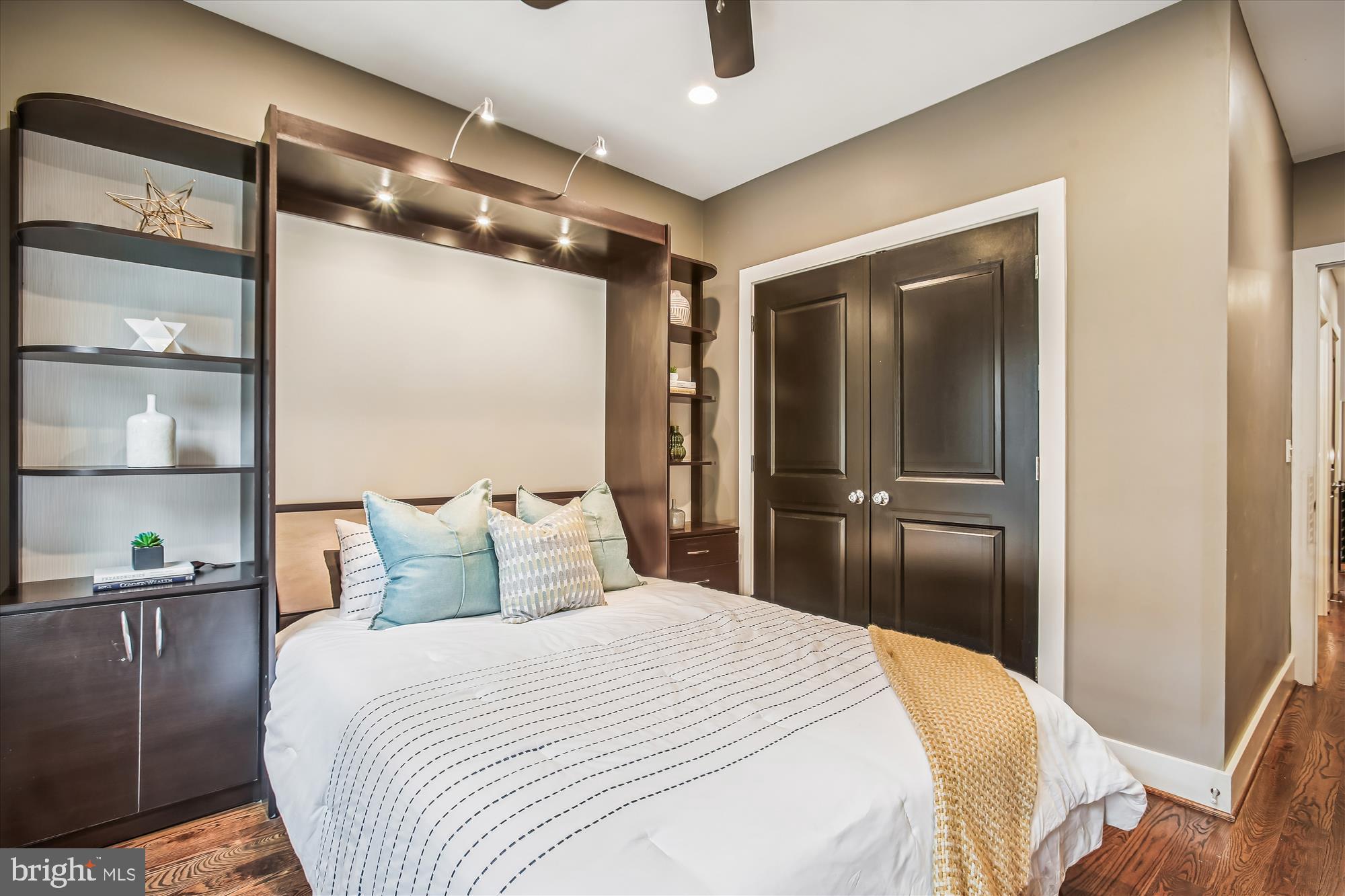 1521 9th Street Northwest Washington, DC 20001 - Photo 24 of 35 a bedroom with a large bed and a closet