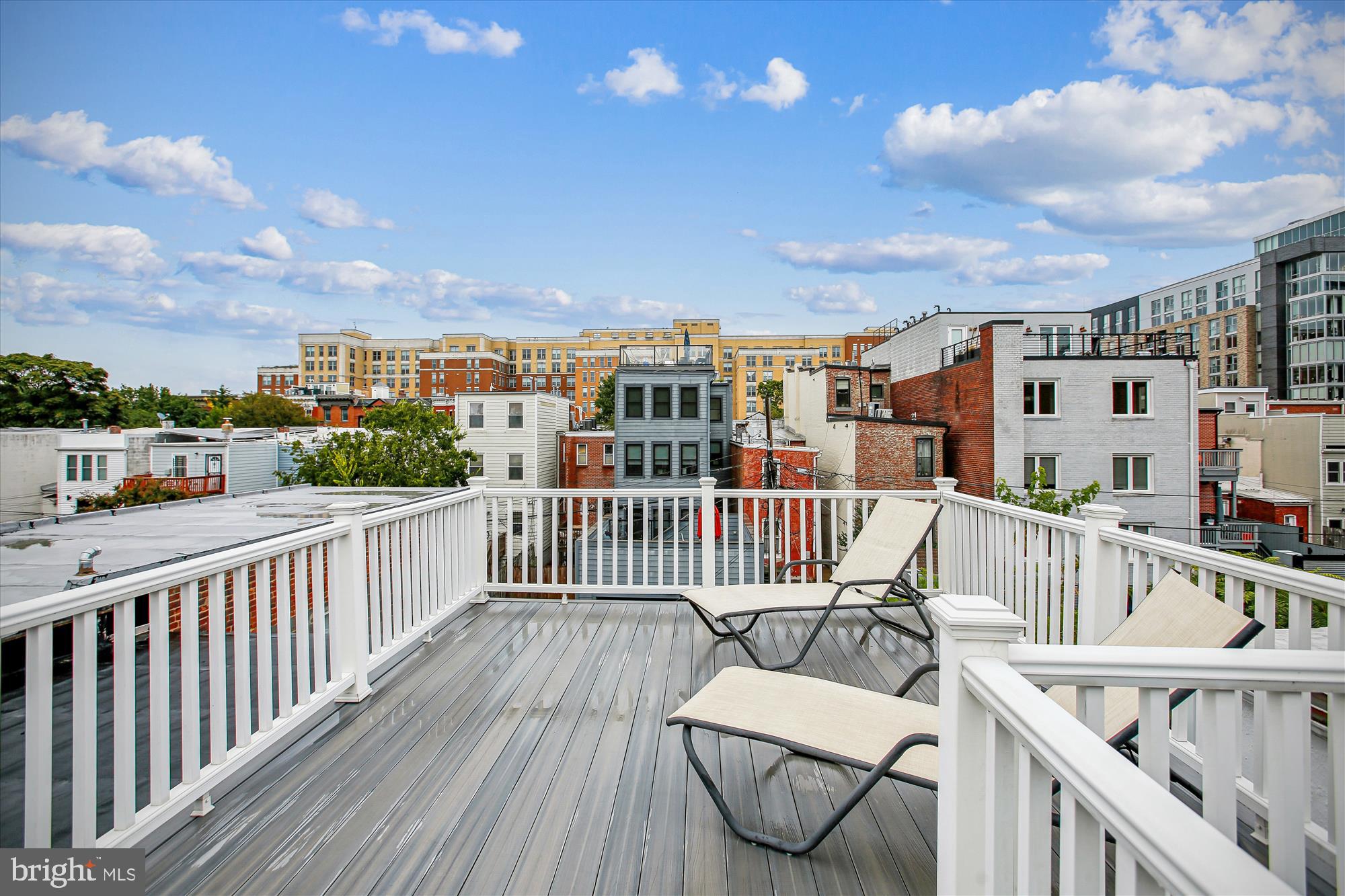 1521 9th Street Northwest Washington, DC 20001 - Photo 31 of 35 a view of a balcony with wooden chairs