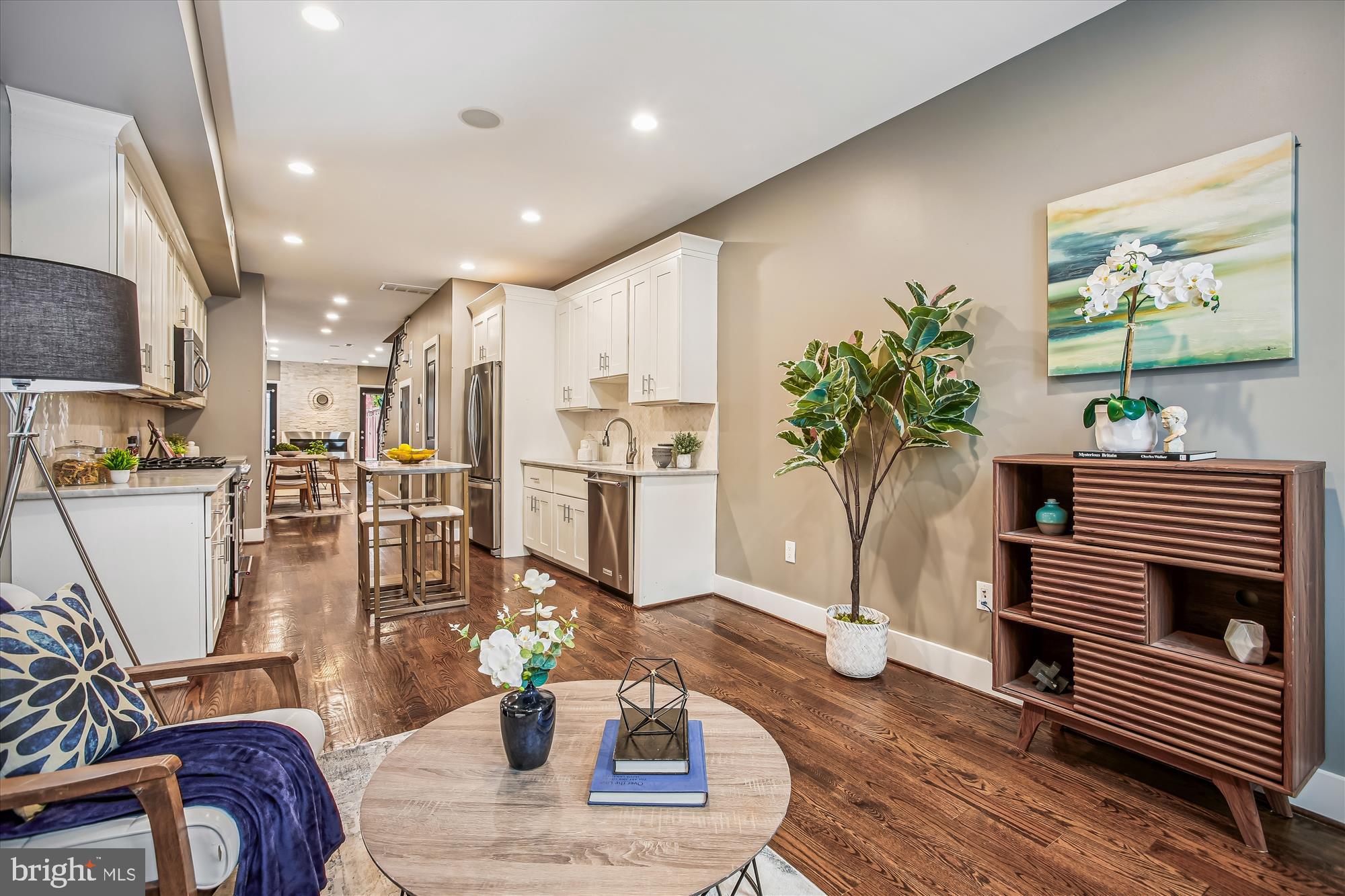 1521 9th Street Northwest Washington, DC 20001 - Photo 8 of 35 a living room with kitchen island furniture and a potted plant