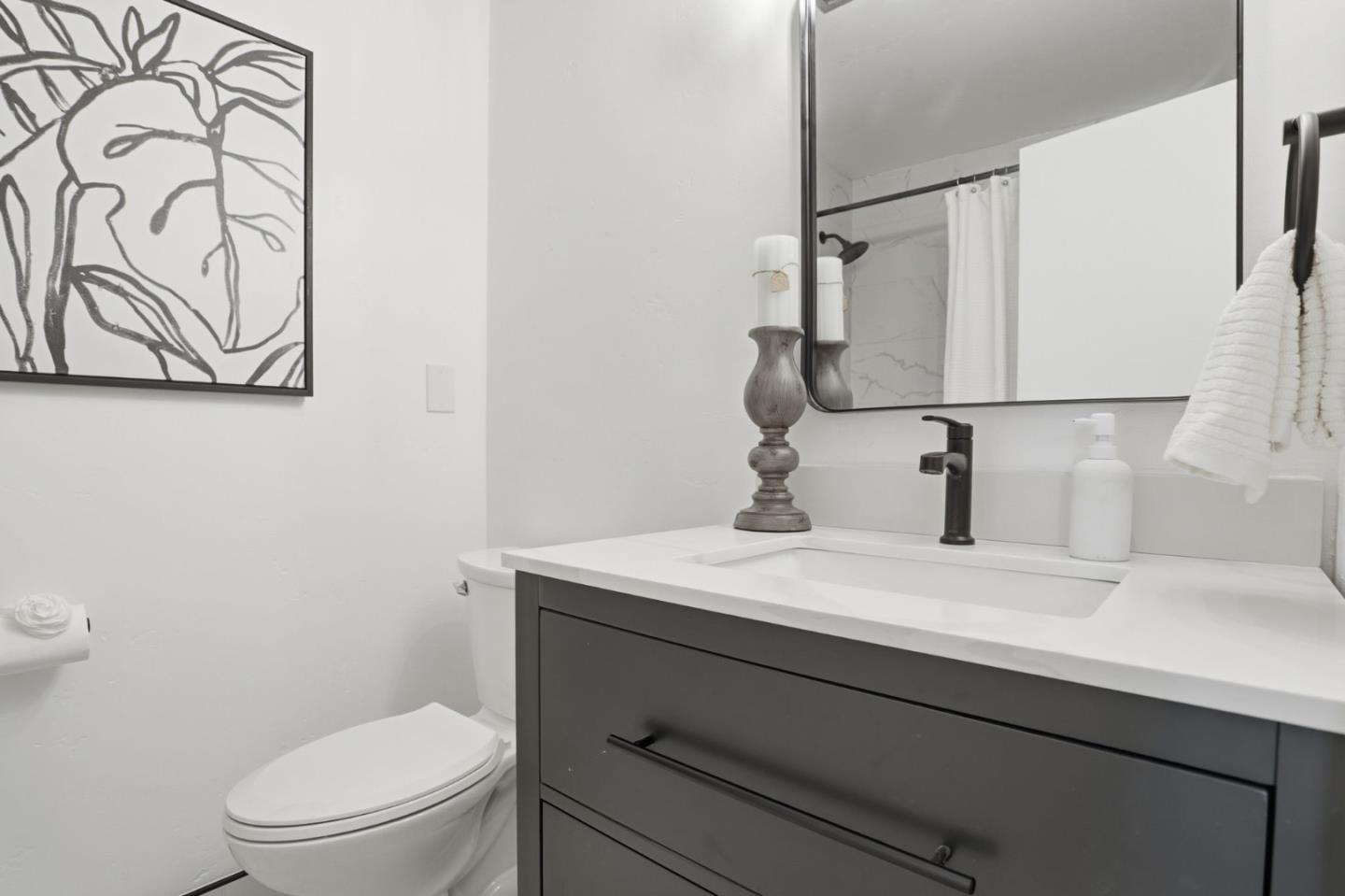 3233 Maplethorpe Lane Soquel, CA 95073 - Photo 14 of 35 a bathroom with a sink a toilet and mirror