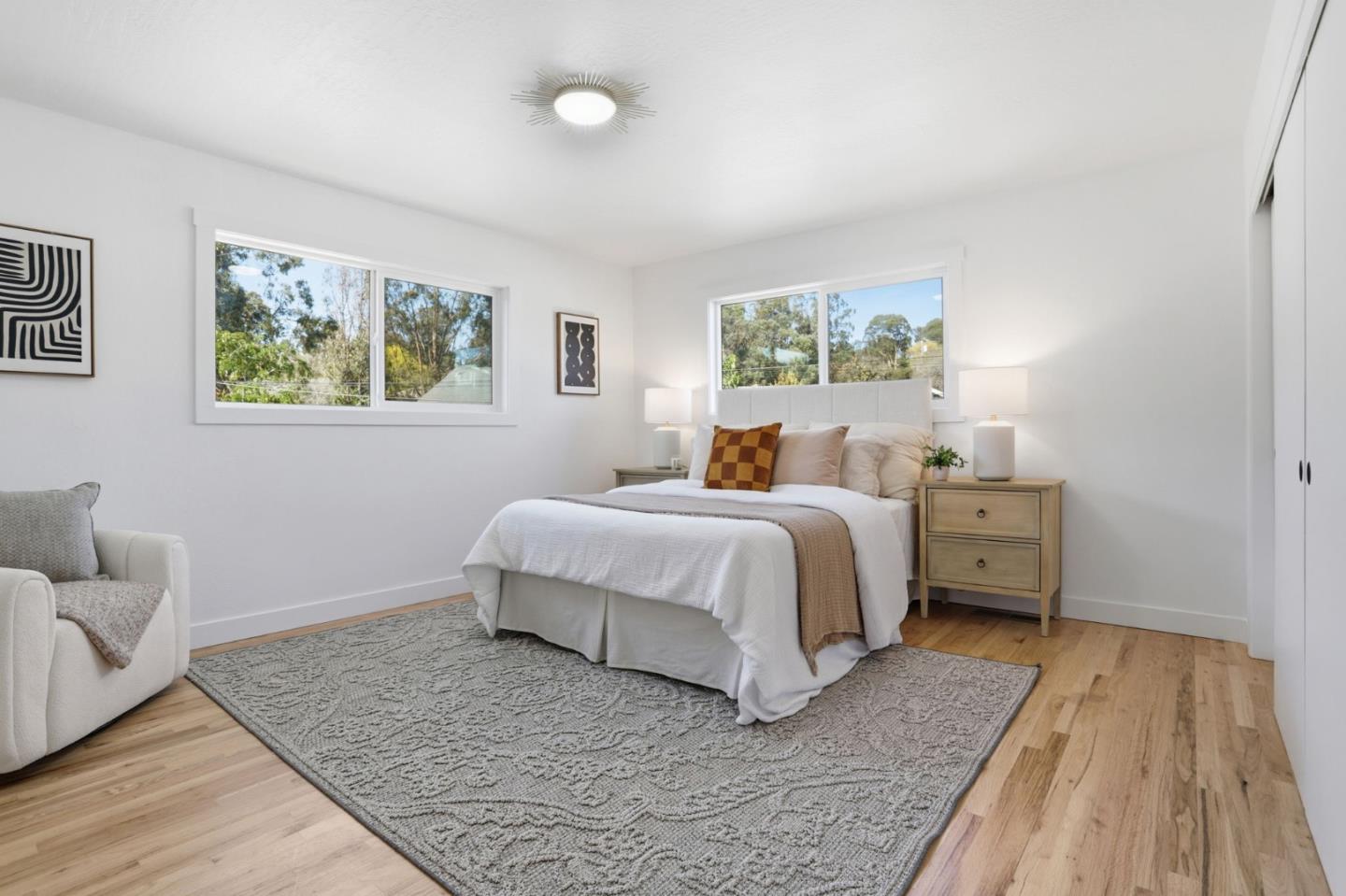 3233 Maplethorpe Lane Soquel, CA 95073 - Photo 16 of 35 a bedroom with a bed and wooden floor