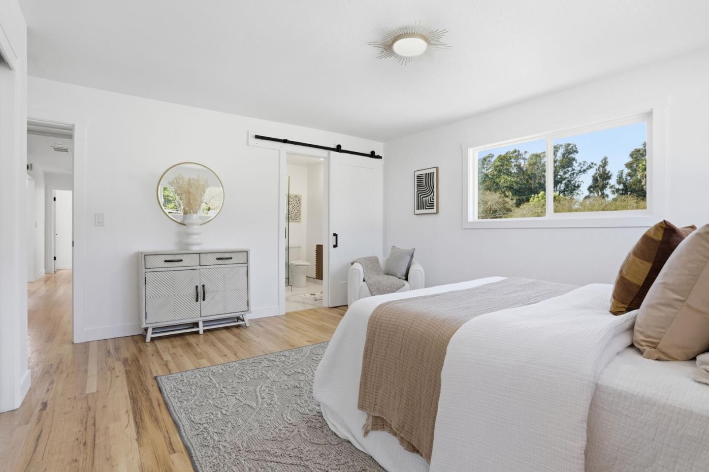 3233 Maplethorpe Lane Soquel, CA 95073 - Photo 17 of 35 a bedroom with a bed and a chandelier