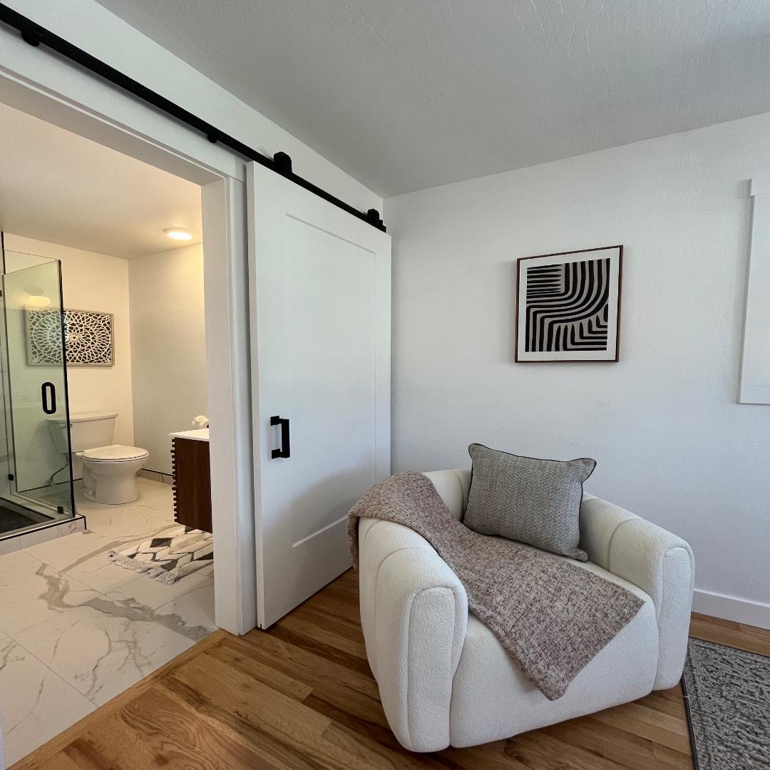 3233 Maplethorpe Lane Soquel, CA 95073 - Photo 18 of 35 a bedroom with a bed and wooden floor