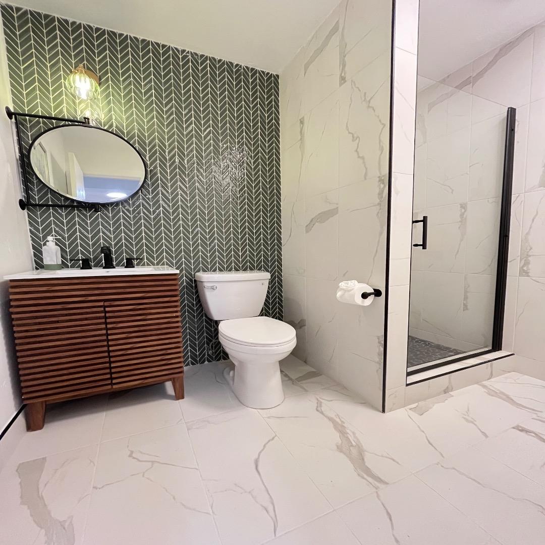 3233 Maplethorpe Lane Soquel, CA 95073 - Photo 30 of 35 a bathroom with a toilet a sink and mirror