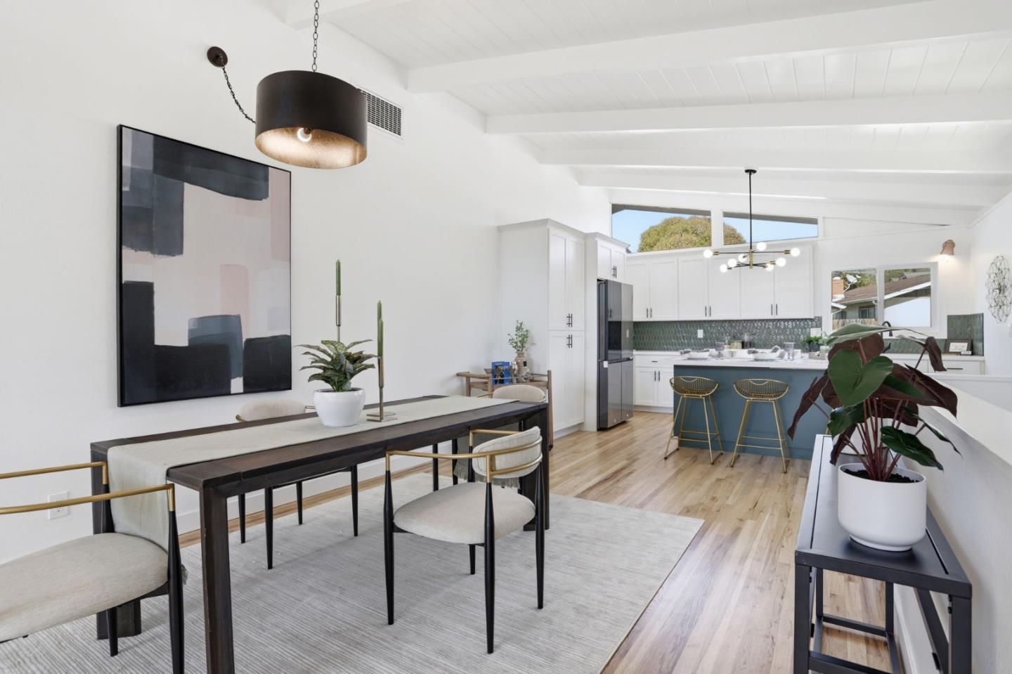 3233 Maplethorpe Lane Soquel, CA 95073 - Photo 5 of 35 a kitchen with a dining table chairs stainless steel appliances and cabinets
